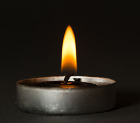 Candle representing remembrance and grief